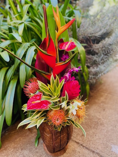 tropical flowers in coconut vase